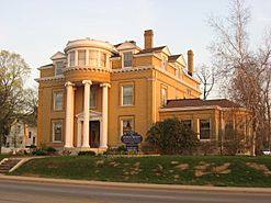 Old three-story mansion with columns and round observatory