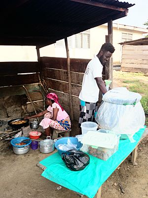Koko and agawu seller serving
