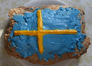 Limpa bread frosted in colors of Swedish flag (cropped)