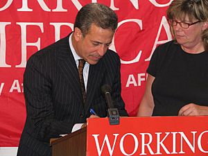 U.S. Senator Russ Feingold signs down as a member of Working America, August 4, 2008
