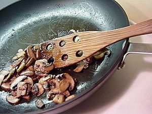 Baby bella (portobello) mushrooms being sautéed