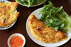 Banh Xeo with fish sauce and vegetables.jpg