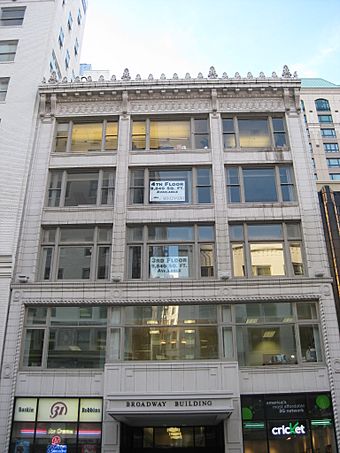 Photograph of a five story downtown office building.