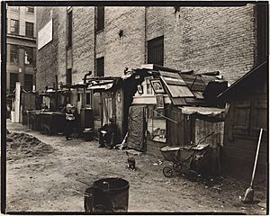Huts and unemployed, West Houston and Mercer St., Manhattan (NYPL b13668355-482853)