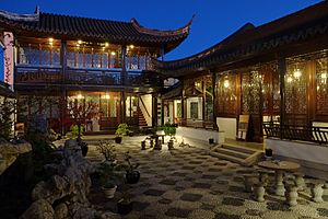 Tower block and courtyard in Dunedin Chinese Garden at night
