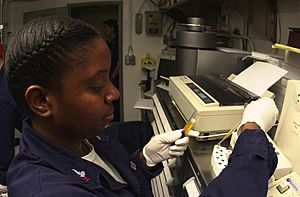 US Navy 030923-N-1577S-003 Hospital Corpsman 2nd Class Donna Sanderson from Lancaster, Calif., prepares serum cups