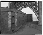 A general view of the northwest wall, in relation to the Fort Point arch of the golden gate bridge. View to southwest. - Fort Point, U.S. Highway 101, San Francisco, San HABS CAL,38-SANFRA,4-54