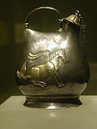 Gilt silver jar with pattern of dancing horses