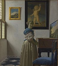 Johannes Vermeer -. Dame staand bij een maagd