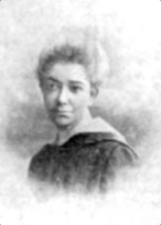 A photograph of the head and shoulders of a woman