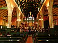 Nave with choir practice St Michael and All Angels Bedford Park