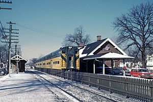 Chicago and North Western southbound Commuter Streamliner -338 stopping at Wilmette, IL station on January 24, 1963 (27584283014)