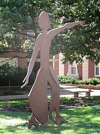 sheetmetal outline of woman with outstretched arms