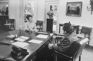 Julie Eisenhower talking to Richard M. Nixon in the oval office. - NARA - 194745