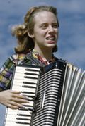 Lois Duncan Steinmetz playing the accordion aboard the shantyboat Lazy Bones (cropped)