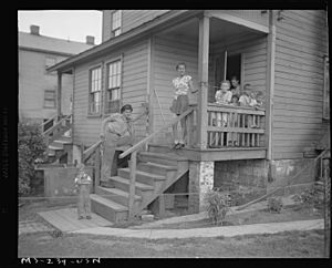 Miner's family on porch of company home at H.C. Frick Coke Company in Muse, 1946