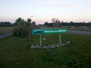 Welcome sign to Loburn, looking east towards Loburn School (2013).