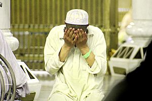 Young Muslim spplicating in Masjid al-Haram, 6 April 2015