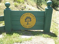 The Circle Oaks logo, as seen from the bus stop near Monticello Road and Circle Oaks Drive