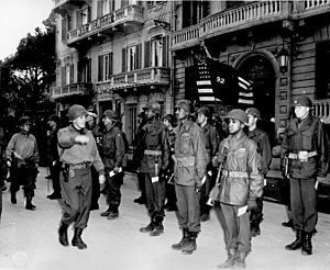 Maj. Gen. Edward M. Almond, Commanding General of the 92nd Infantry (`Buffalo') Division in Italy, inspects his troops during a decoration ceremony