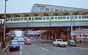 Old downtown Seattle monorail terminal over Pine St from east in 1982