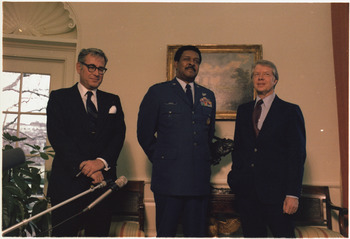 Secretary of Defense Harold Brown and General Daniel "Chappie" James visit with Jimmy Carter. - NARA - 177740