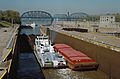 Towboat Steel Trader departing auxiliary lock at McAlpine Locks, 1987, Ohio River mile 607 (87j173)