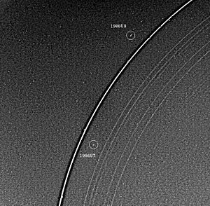 Uranus rings and two moons.jpg