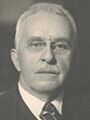 Wilbur L Cross sitting in chair (cropped)