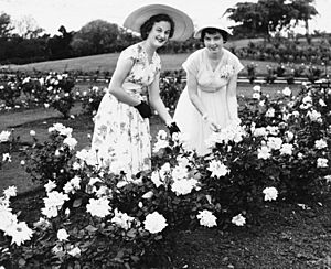 Miss P. Conrad and Miss C. McGuire in the rose garden at New Farm Park, Brisbane, 1954 (6983285043)