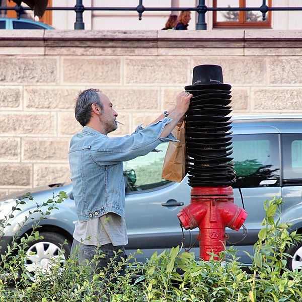 Image 01 Irrational behavior, surreal absurd street scene in Budapest