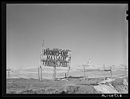 Church and trading post sign, Wounded Knee, South Dakota, in 1940