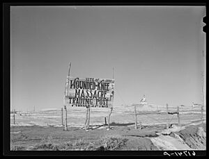 Church and trading post sign, Wounded Knee, South Dakota, in 1940