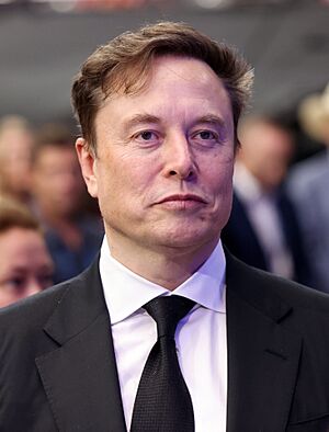 Elon Musk smiling at an event