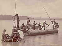 Group of Andaman Men and Women in Costume, Some Wearing Body Paint And with Bows and Arrows, Catching Turtles from Boat on Water