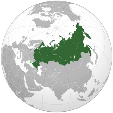Russia on the globe with Crimea in light green. 