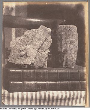 Still life with ancient Babylonian artifacts on books