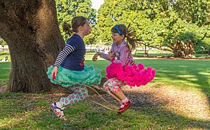 Two girls playing skipping rope