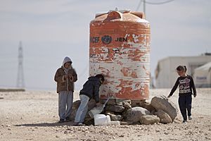 Children filling water in Al-Zaatari Camp