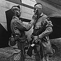 Paratrooper applies war paint 111-SC-193551cropped