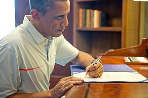 President Obama signing the Bipartisan Budget Act of 2013