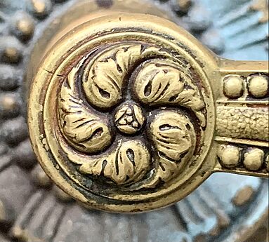 Rosette on a door handle of a door of the University Building (Bucharest, Romania)