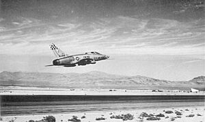 USAF F-100 Super Sabre fighter taking off from Nellis AFB Nevada circa 1959