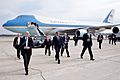 United States President Barack Obama with Senator Sherrod Brown, Representative Mary Jo Kilroy, and Secret Service personnel arriving at Port Columbus International Airport