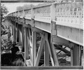 VIEW OF SOUTH SIDE OF BRIDGE, LOOKING WEST FROM DECK LEVEL - New London Bridge, Spanning Embarrass River on State Trunk Highway 54, New London, Waupaca County, WI HAER WIS,44-NELO.V,1-3