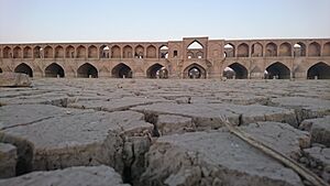 Zayanderud river dry with Si-o-se-pol on background