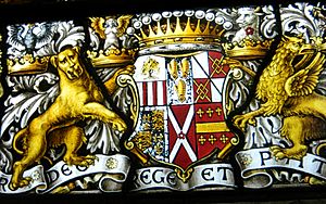 A full heraldic achievement, lowest part of an 1889 window by A. L. Moore, at S.S. Peter & Paul, Harlington, Middlesex