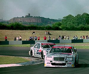 Ellen Lohr - AMG-Mercedes C Klasse leads teamate Klaus Luwig at Melbourne Hairpin (32869944448)