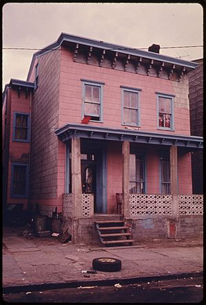 HOUSE IN THE INNER CITY OF PATERSON, NEW JERSEY. THE INNER CITY TODAY IS AN ABSOLUTE CONTRADICTION TO THE MAIN STREAM... - NARA - 555903