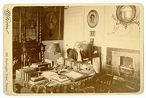 Henry Wadsworth Longfellow in his study seated by the fireplace, 1875-1882 - Original